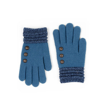 A woman wearing a blue Britt's Knits hat and Britt's Original Gloves for cold weather.