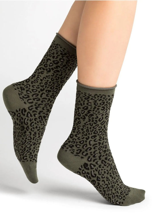 A woman's unique legs adorned with timeless Bleuforet 6195 Leopard Print Socks.