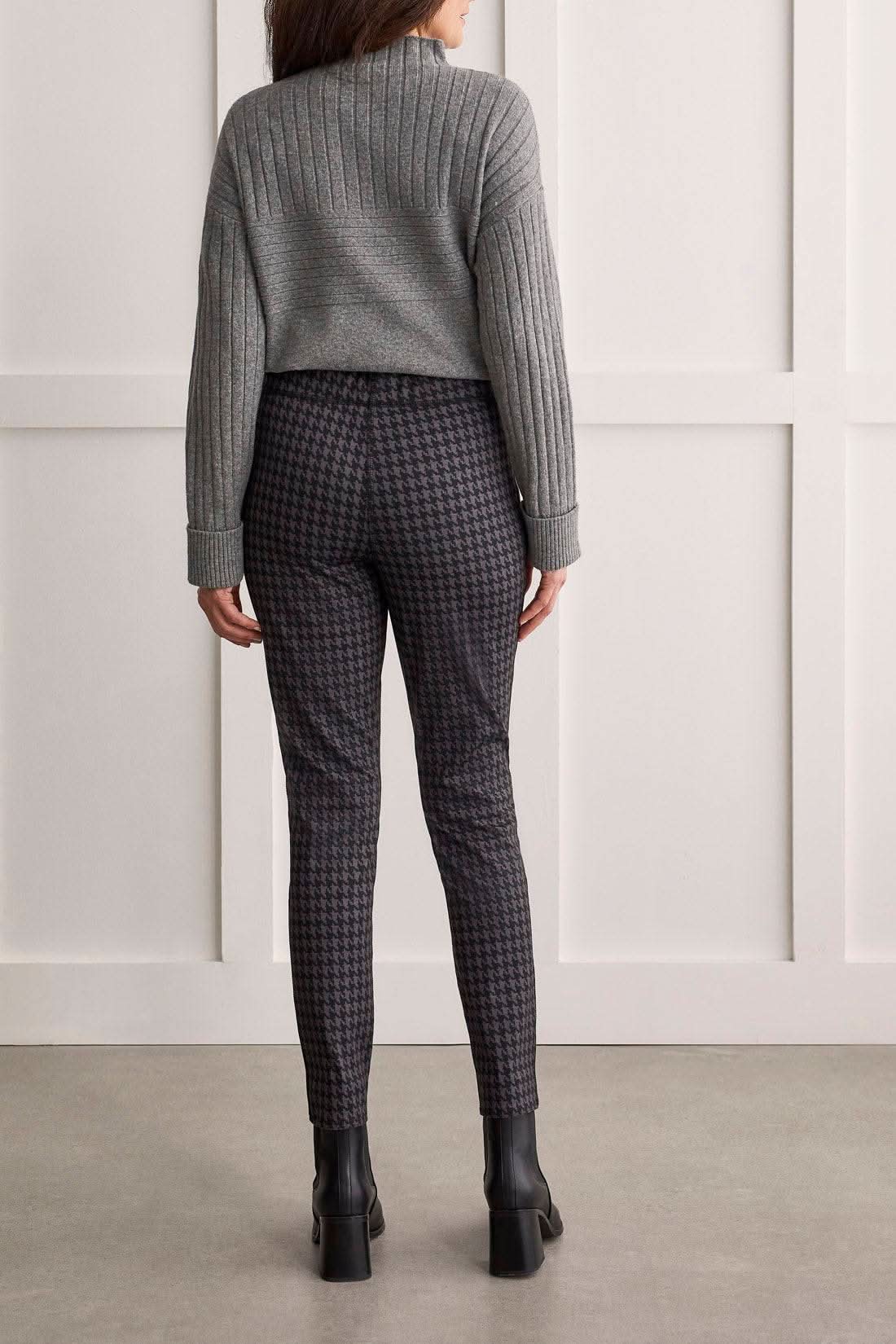 A woman wearing a grey sweater and Tribal's Pull On Reversible Pant.