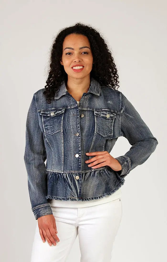 Woman wearing a Fresh FX Stretch Denim Jacket and white pants smiles in comfort while looking to the side.