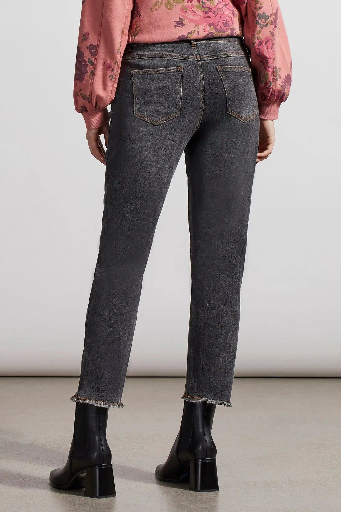 A woman wearing Tribal Audrey GF Straight Ankle Jean with a frayed bottom.