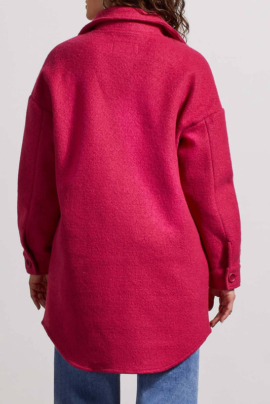 A woman wearing a Tribal Stretch Wool Jacket, providing both comfort and style, paired with jeans for a relaxed yet fashionable look.