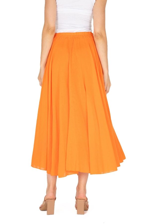 The sentence could be rewritten as: Rear view of a person in a white top and stylish M Made In Italy Tangerine Woven Skirt, paired with beige high heels.