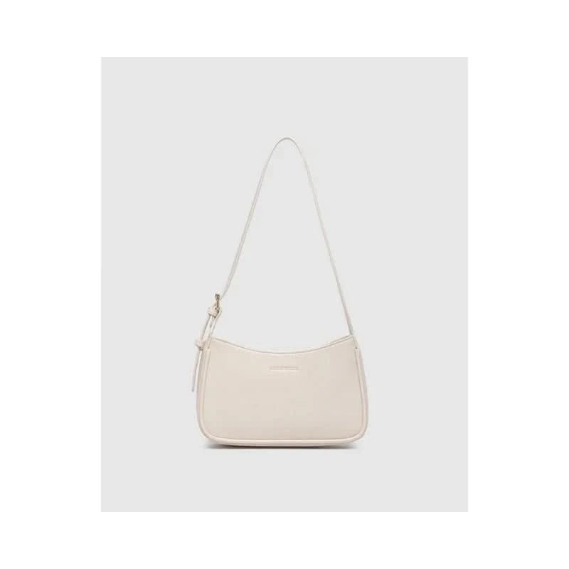 The Louenhide Ivy Shoulder Bag in Vanilla is a small, rectangular, off-white minimalist handbag with a single strap, shown against a plain light gray background.