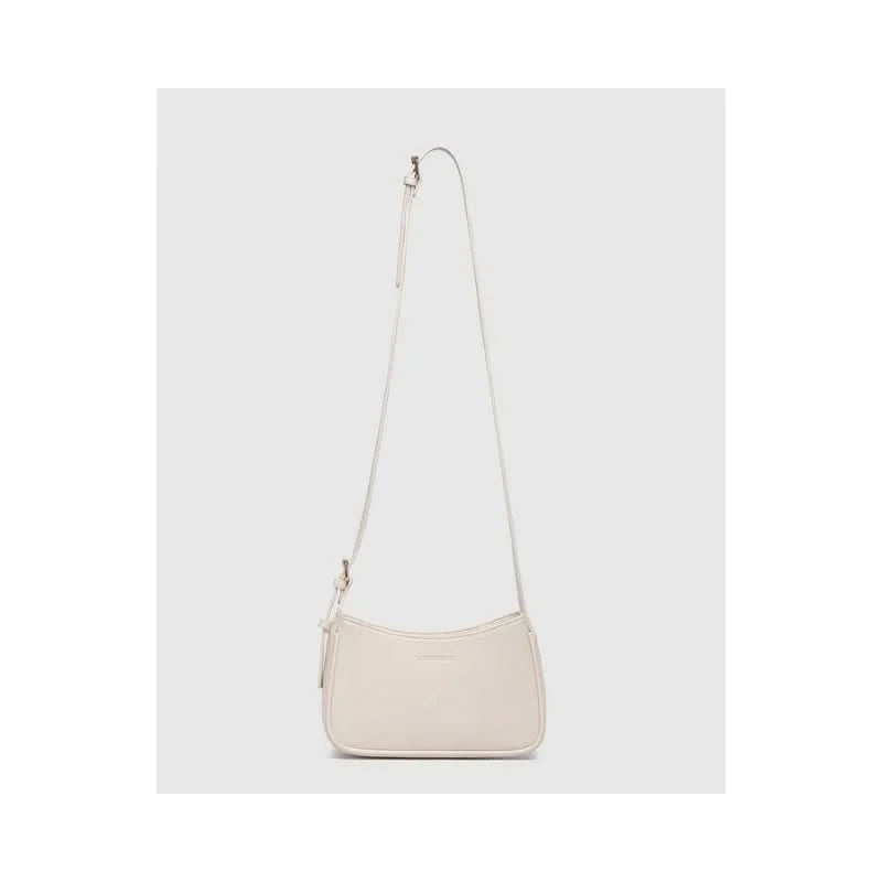 The Louenhide Ivy Shoulder Bag in Vanilla is a small, rectangular, off-white minimalist handbag with a single strap, shown against a plain light gray background.