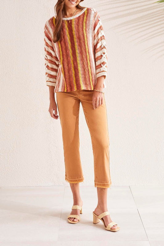 A woman wearing a Tribal 3/4 Sleeve Lace Up Boat Neck Sweater.