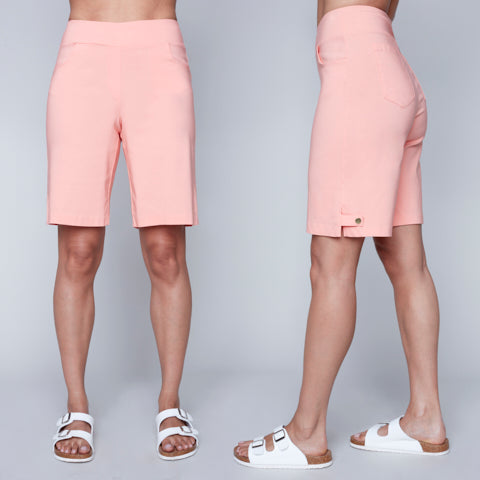 Navy blue Carre Noir woven capri shorts and white sandals showcased from the front and side views.