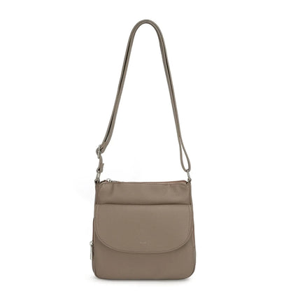 The Stelle organizer crossbody by Co-Lab features taupe vegan leather, a long adjustable strap, front flap pocket, and silver hardware, shown on a plain white background.