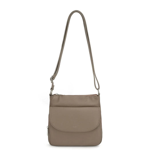 The Stelle organizer crossbody by Co-Lab features taupe vegan leather, a long adjustable strap, front flap pocket, and silver hardware, shown on a plain white background.