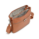 Co-Lab THE 'ARQUETTE' CROSSBODY: tan vegan leather bag with silver hardware, front zipper pocket, and adjustable strap, shown on a white background.