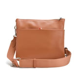 Co-Lab THE 'ARQUETTE' CROSSBODY: tan vegan leather bag with silver hardware, front zipper pocket, and adjustable strap, shown on a white background.