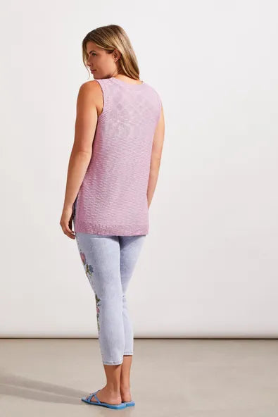 A woman wearing a Tribal pink Sleeveless Tunic with a Side Slit.