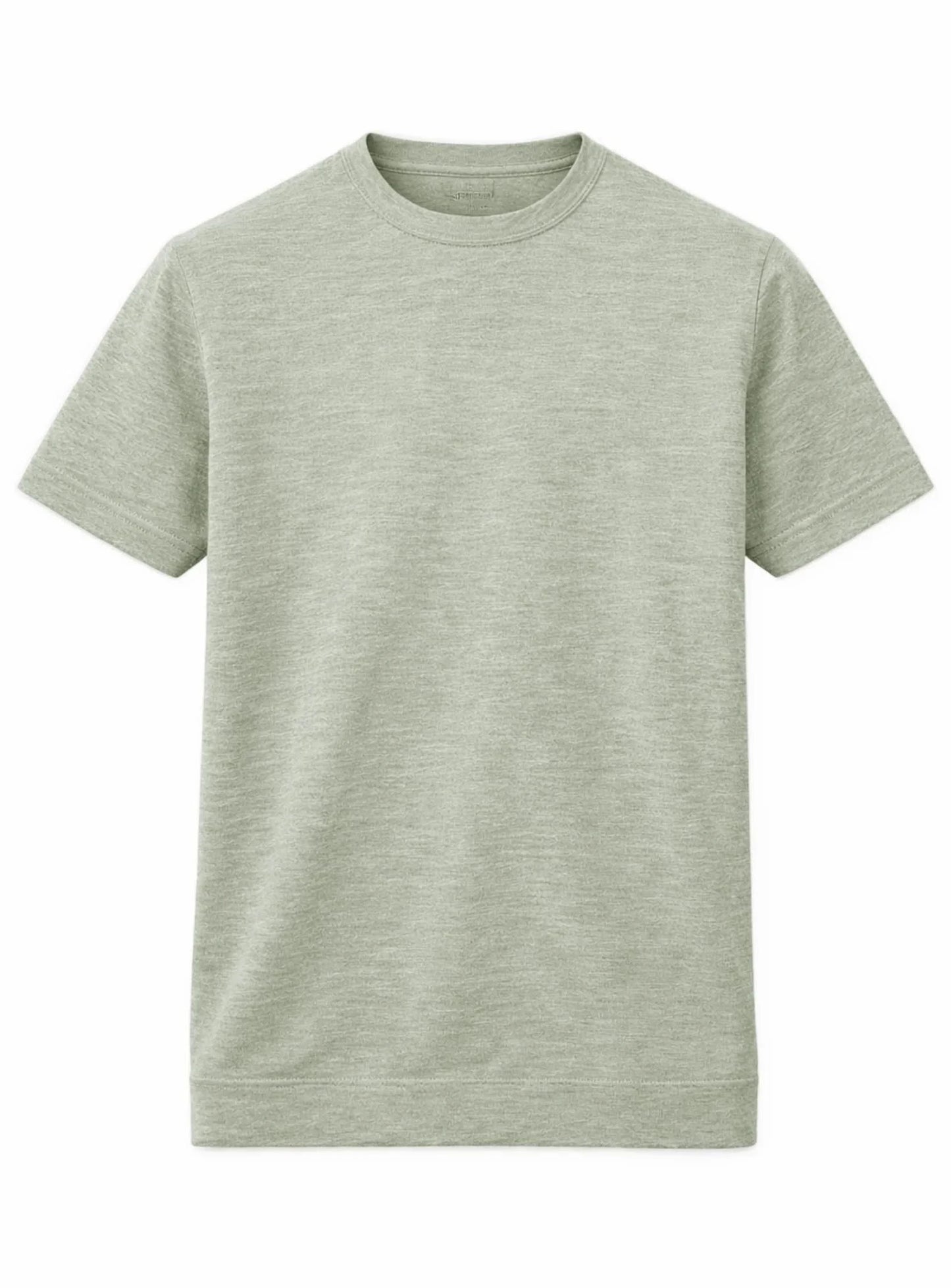 A man showcases effortless summer style in a Point Zero Mens Short Sleeve Active Top, paired with gray pants and white sneakers, standing against a plain background with one hand in his pocket.