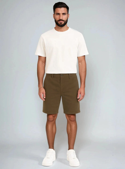 The Mens Super Flex Bermuda short by Point Zero, in gray, features side and back pockets, belt loops, a front button and zipper closure. These relaxed fit shorts provide comfort and style, shown on a white background.