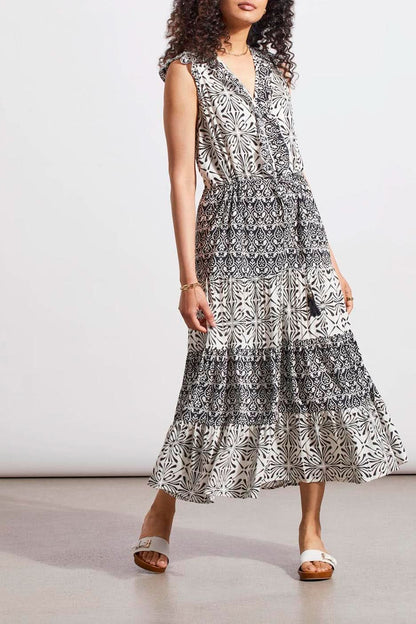 A versatile woman wearing a Tribal Combo Print Lined Dress with Drawstring waist.