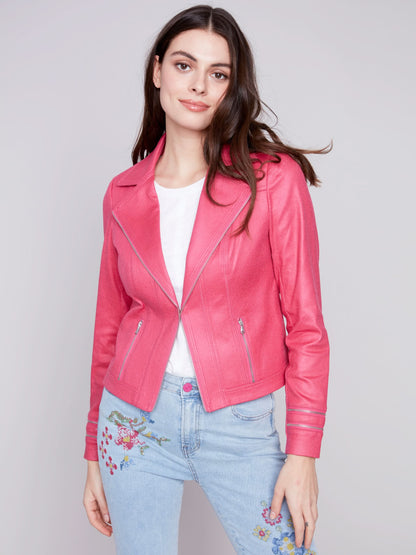 A woman wearing a yellow Charlie B Vintage Moto Faux Leather Jacket.