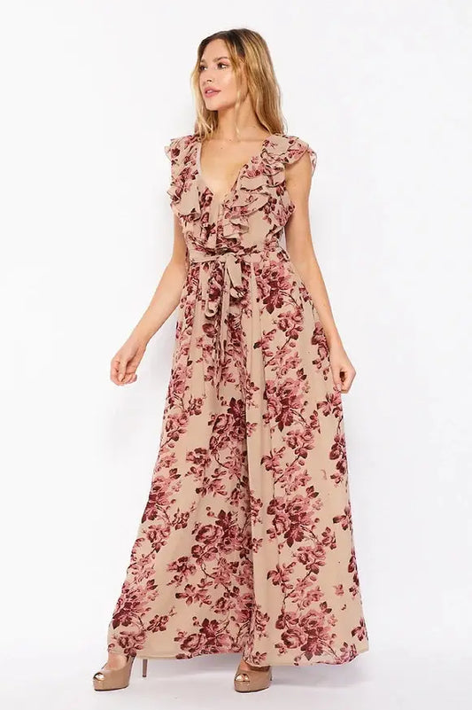 A woman wearing a Vanilla Monkey Floral Print Sleeveless Jump Suit.