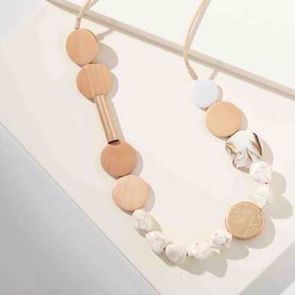 The Merx Wood, Beads & Stones Necklace showcases round wooden, marbled, white, and gold textured beads on a light background—a standout artisanal jewelry piece.
