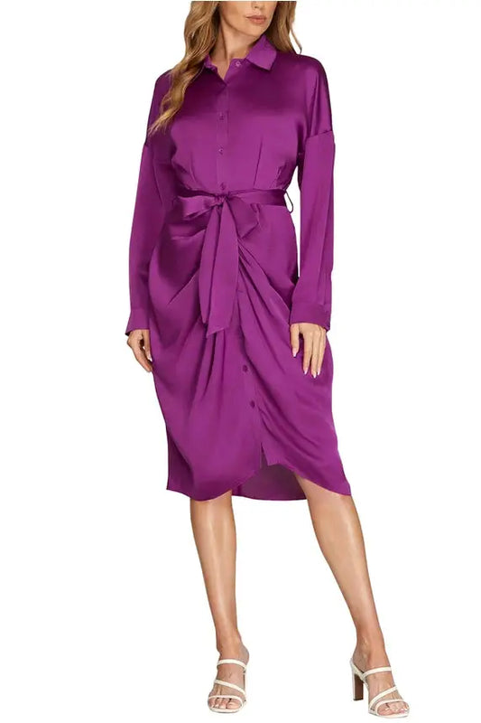 The model is wearing a Shirred Skirt Cuff Sleeve Drop Collar Midi Satin Dress from Vanilla Monkey.