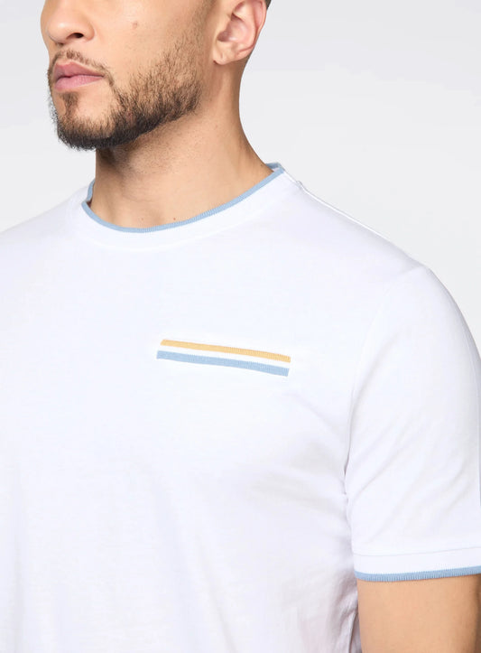 A man wears the Point Zero Mens Crewneck T-shirt—a modern minimalist white tee with light blue trim and a small striped chest accent—showcasing premium casual style.
