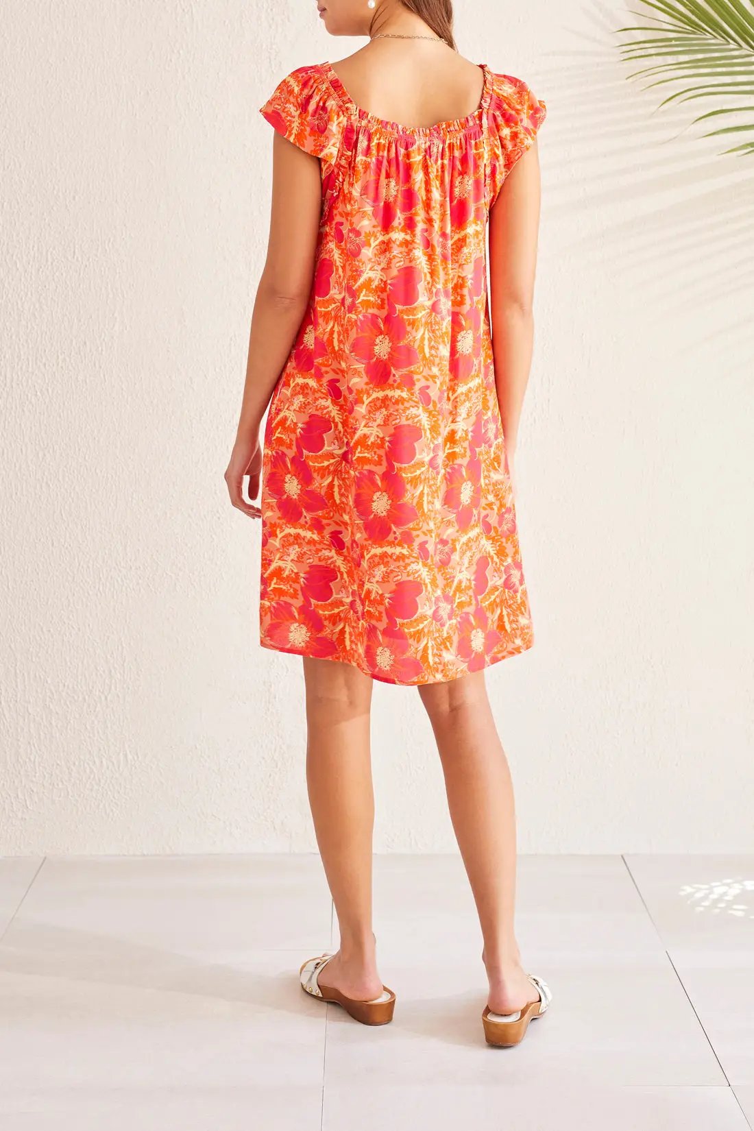 A woman wearing a Tribal Raspberry Front Tie Short Sleeve Dress.