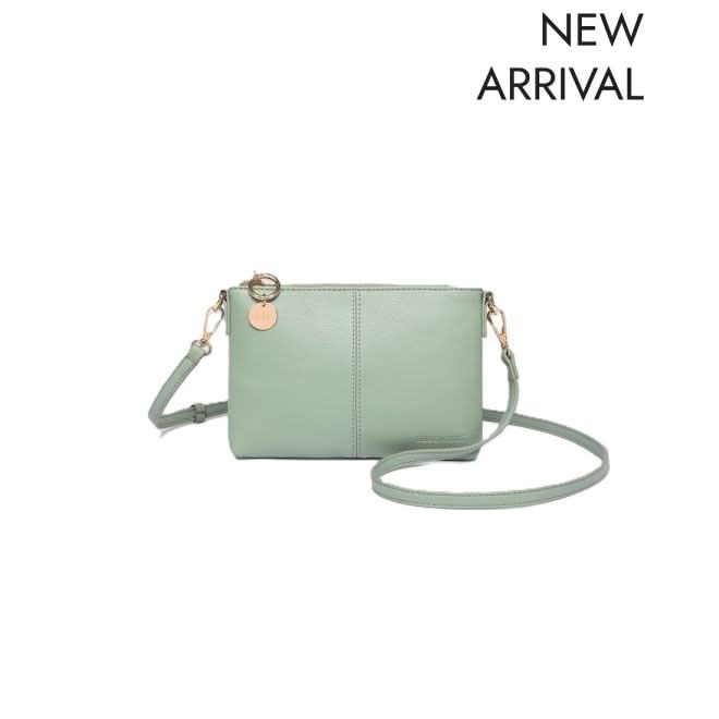 The Louenhide BABY SOPHIE CROSSBODY BAG, a light green vegan leather purse with gold hardware and a removable strap, is pictured against a white background with "NEW ARRIVAL" in the upper right corner.