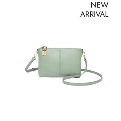 The Louenhide BABY SOPHIE CROSSBODY BAG, a light green vegan leather purse with gold hardware and a removable strap, is pictured against a white background with "NEW ARRIVAL" in the upper right corner.