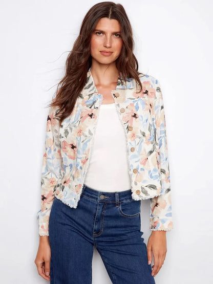 A woman models the Charlie B Printed Linen Blend Jacket over a white top and blue jeans against a plain white backdrop—a stylish spring essential.