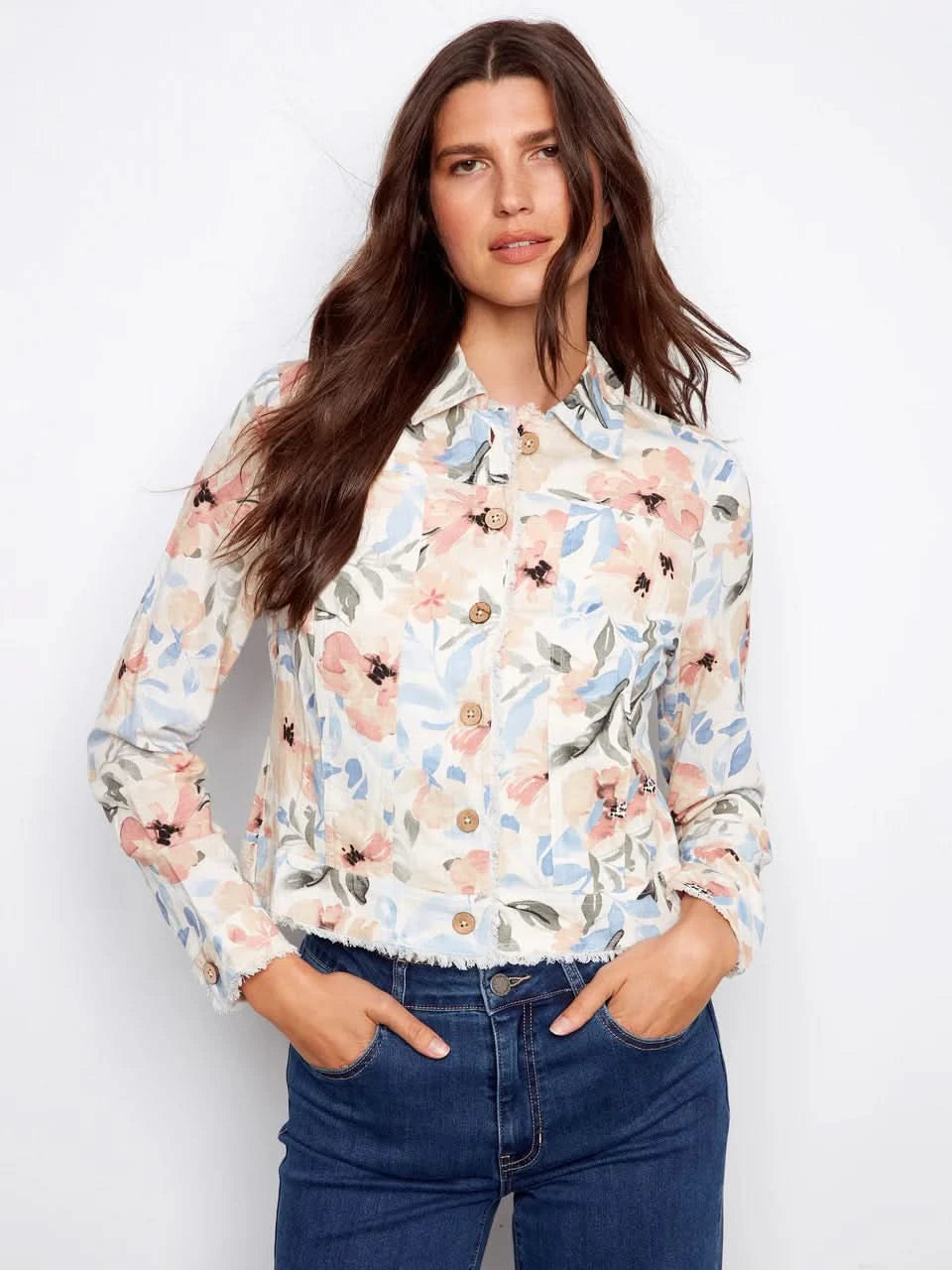 A woman models the Charlie B Printed Linen Blend Jacket over a white top and blue jeans against a plain white backdrop—a stylish spring essential.