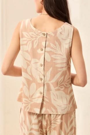 The Tribal LINEN SQUARE-NECK TOP features a sleeveless design and white leaf pattern, offering a breathable and stylish option for summer when paired with matching loose pants.