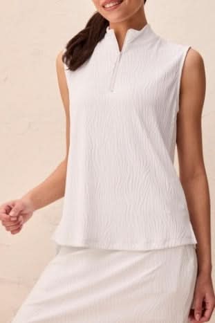A woman models the Tribal TEXTURED QUARTER ZIP, a sleeveless white top with a high mock neck and quarter zip, shown from shoulders to mid-torso.