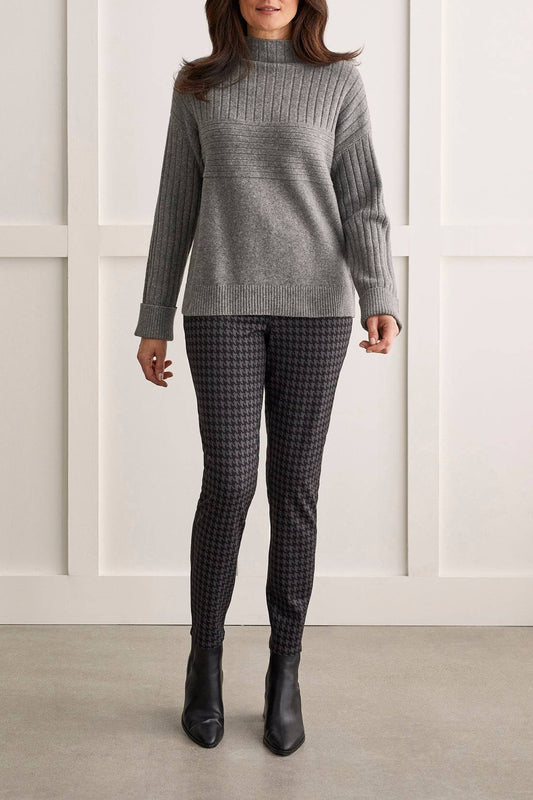 A woman wearing a grey sweater and Tribal's Pull On Reversible Pant.