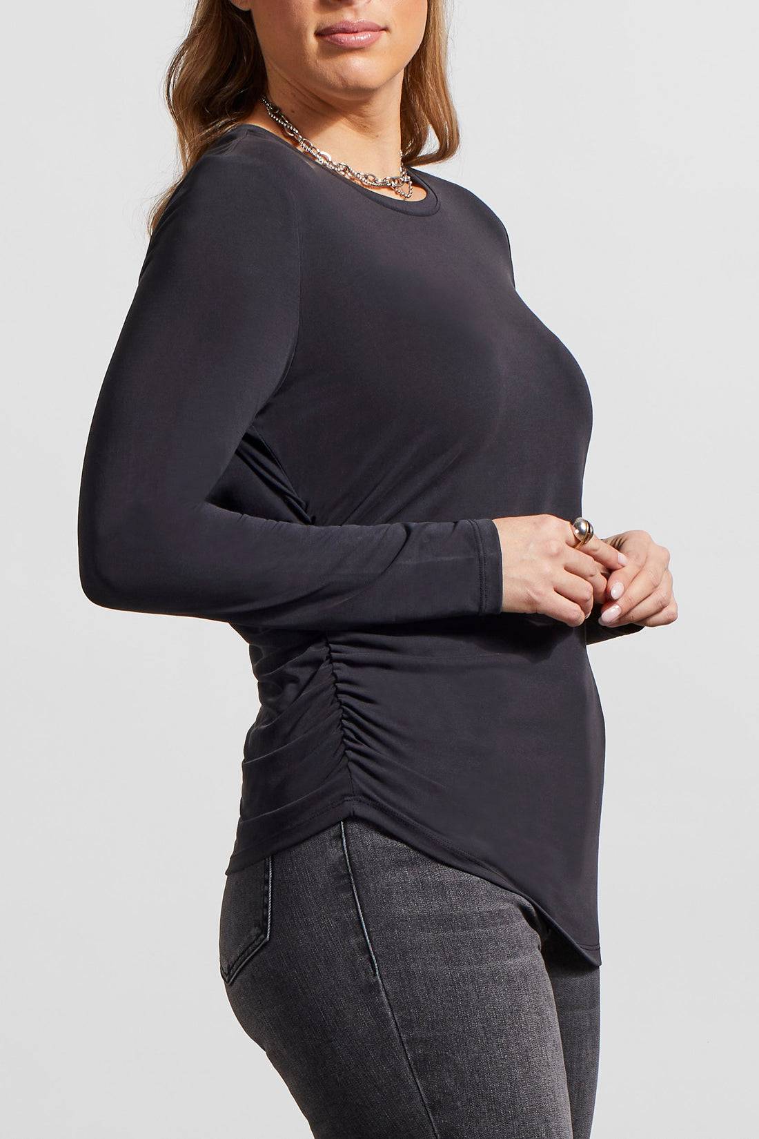 The model is wearing a stylish Tribal Crew Neck Top with Side Ruching.