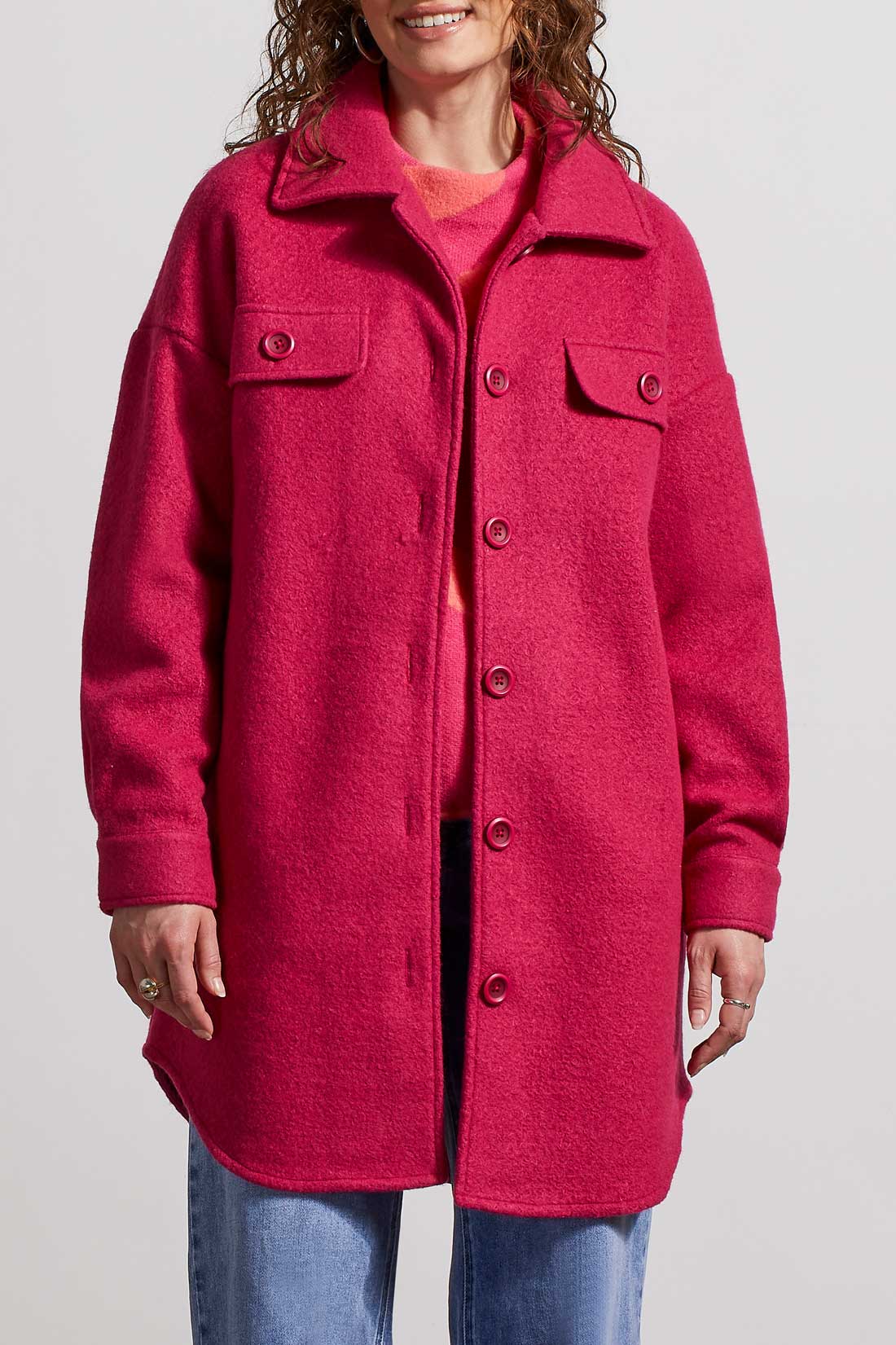 A woman wearing a Tribal Stretch Wool Jacket, providing both comfort and style, paired with jeans for a relaxed yet fashionable look.